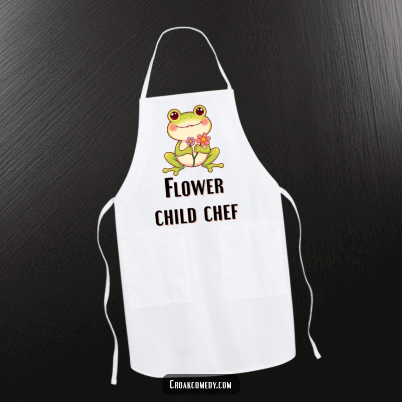 Funny Frog Apron showing a cheerful frog holding a flower, legs spread wide while cooking, a useful and hilarious accessory.