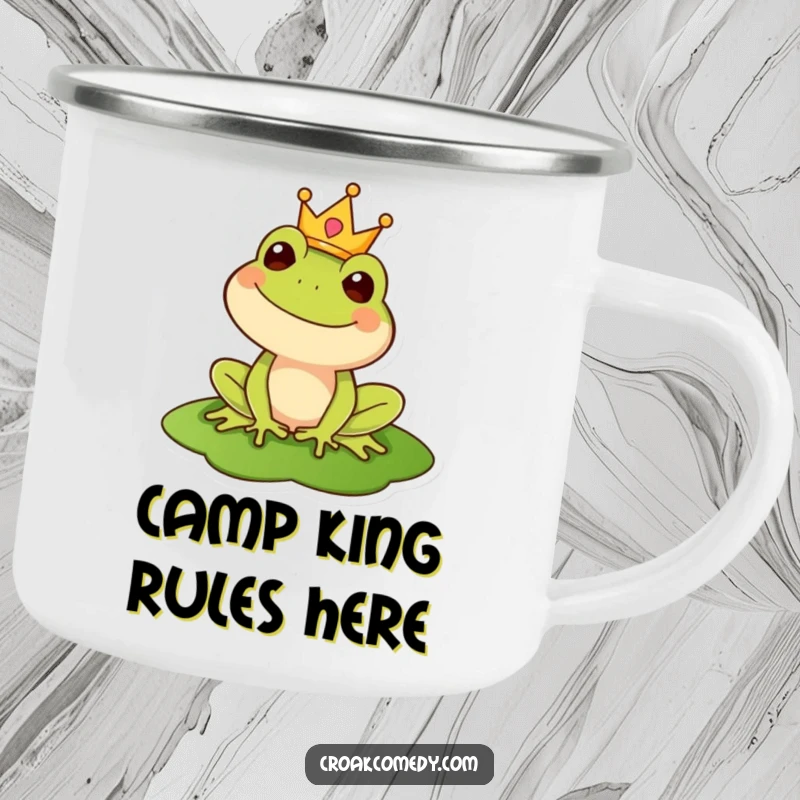 Funny camping mug showcasing a regal frog wearing a crown on a lily pad, designed for outdoor enthusiasts with a royal touch.