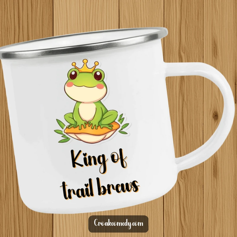 Funny frog wearing a crown sits regally on a mushroom, featured on a durable, humorous camping mug.
