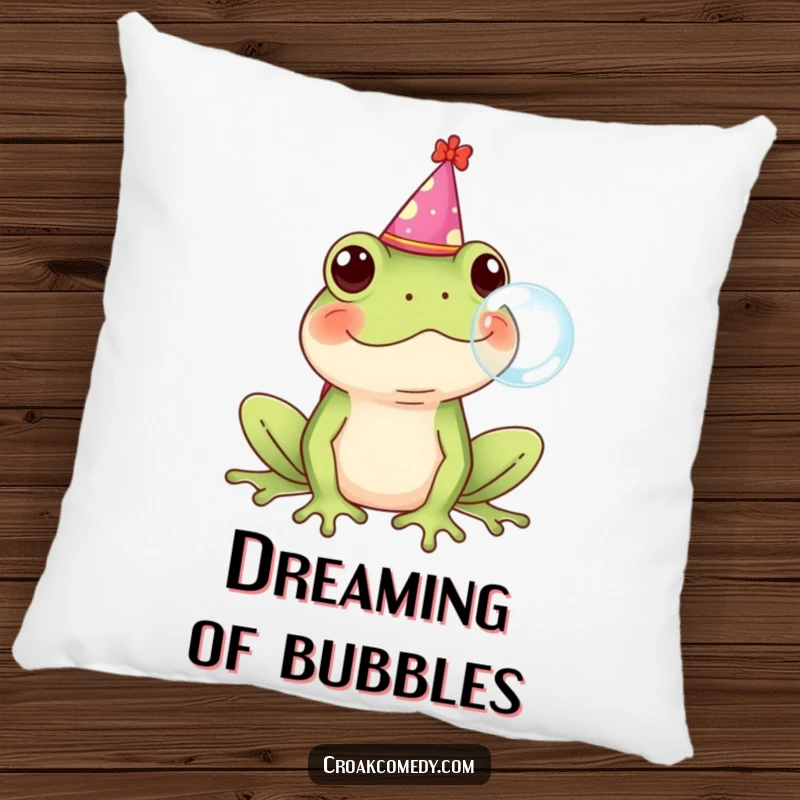 Funny Frog Pillow depicting a frog with a party hat blowing a bubble, offering comfort and humor.