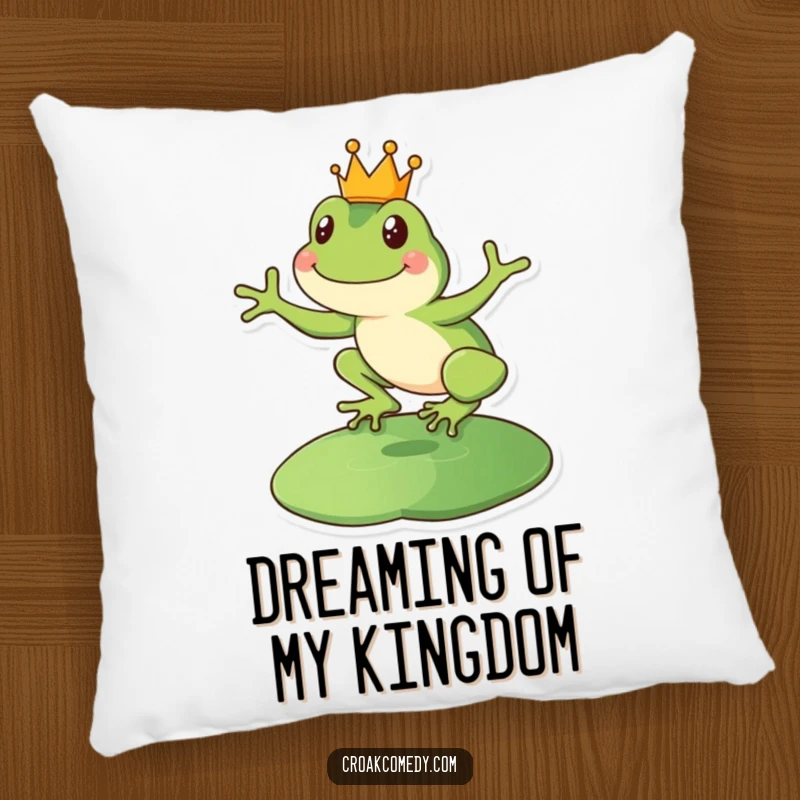 Funny happy frog pillow featuring a crowned amphibian leaping onto a lily pad, offering regal comfort.