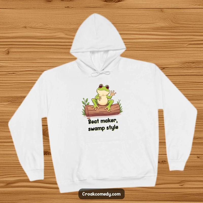 Funny hoodie featuring a frog with enormous feet energetically tapping out a rhythm on a log, perfect for chilly days.