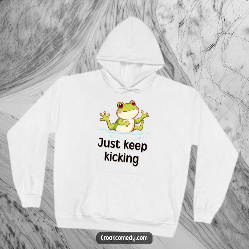 Funny frog hoodie, showing a happy frog with legs kicking as if swimming, radiating warmth and playful energy.
