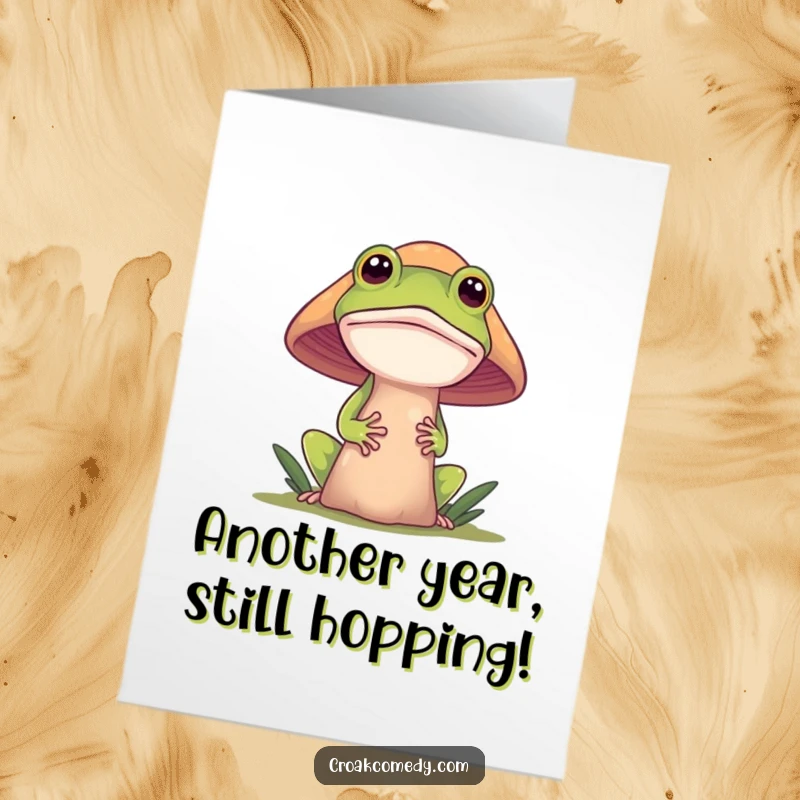 Funny Free Printable Birthday Card featuring a curious frog peeking out from behind a large, colorful mushroom.