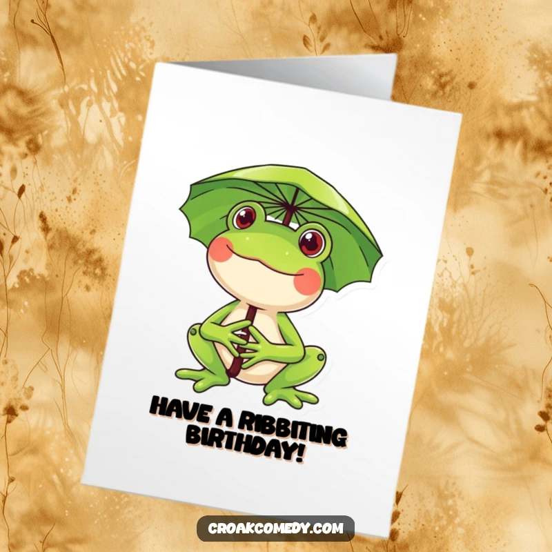 Funny Free Printable Birthday Card: A happy frog grins widely while using a lily pad as a cheerful umbrella.