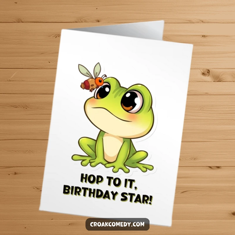 Funny Free Printable Birthday Card: Cartoon frog with massive eyes intensely focused on a tiny fly, ready to pounce.