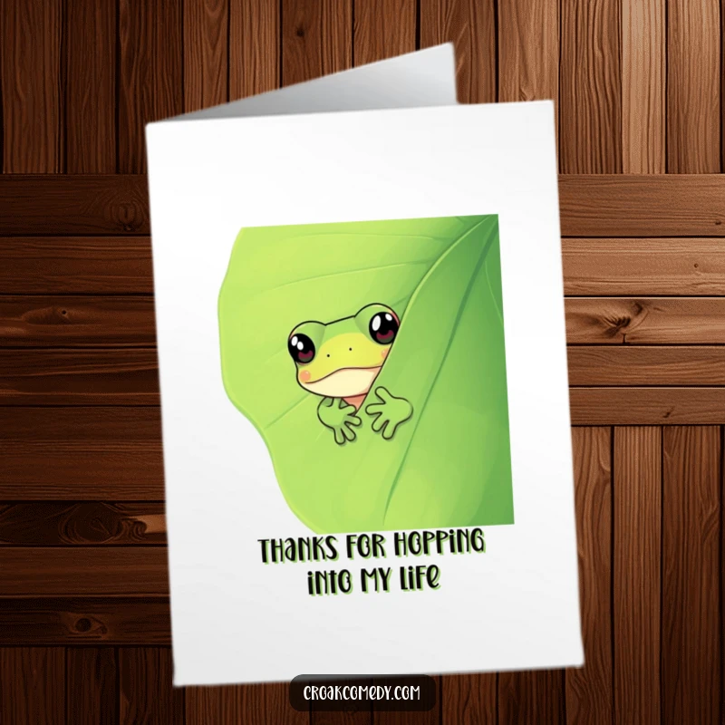 Funny Free Printable Thank You Card: A curious frog with big eyes peeking from behind a lush leaf.