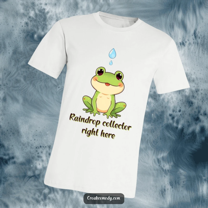 Funny t-shirt showing a smiling frog with its tongue out, catching a falling raindrop with pure delight and excitement.