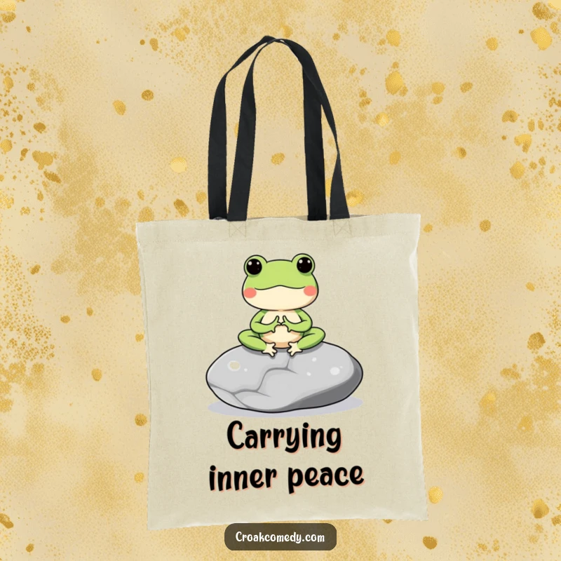 Funny tote bag featuring a meditating frog character on a smooth stone, perfect for carrying essentials peacefully.