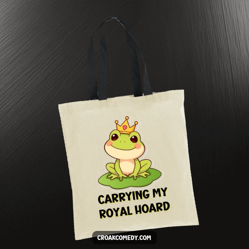 Funny tote bag featuring a happy frog wearing a crown on a lily pad, perfect for carrying essentials with regal flair.