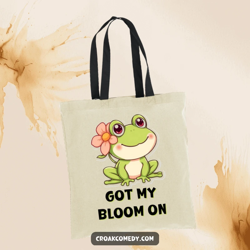 Funny happy frog tote bag featuring a cheerful amphibian wearing a flower behind its ear.